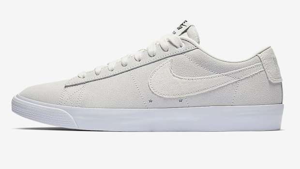 View of off-white colored Nike skate shoes.